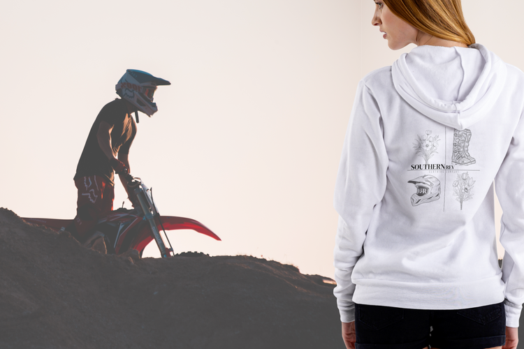 sweatshirt featuring back design of boots, helmet, and flowers